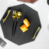 Top view of a black octagon serving tray with a spoon and two biscuits, showcasing the tray's elegant design and the golden-colored handles. The image is clear, emphasizing the tray and its contents.